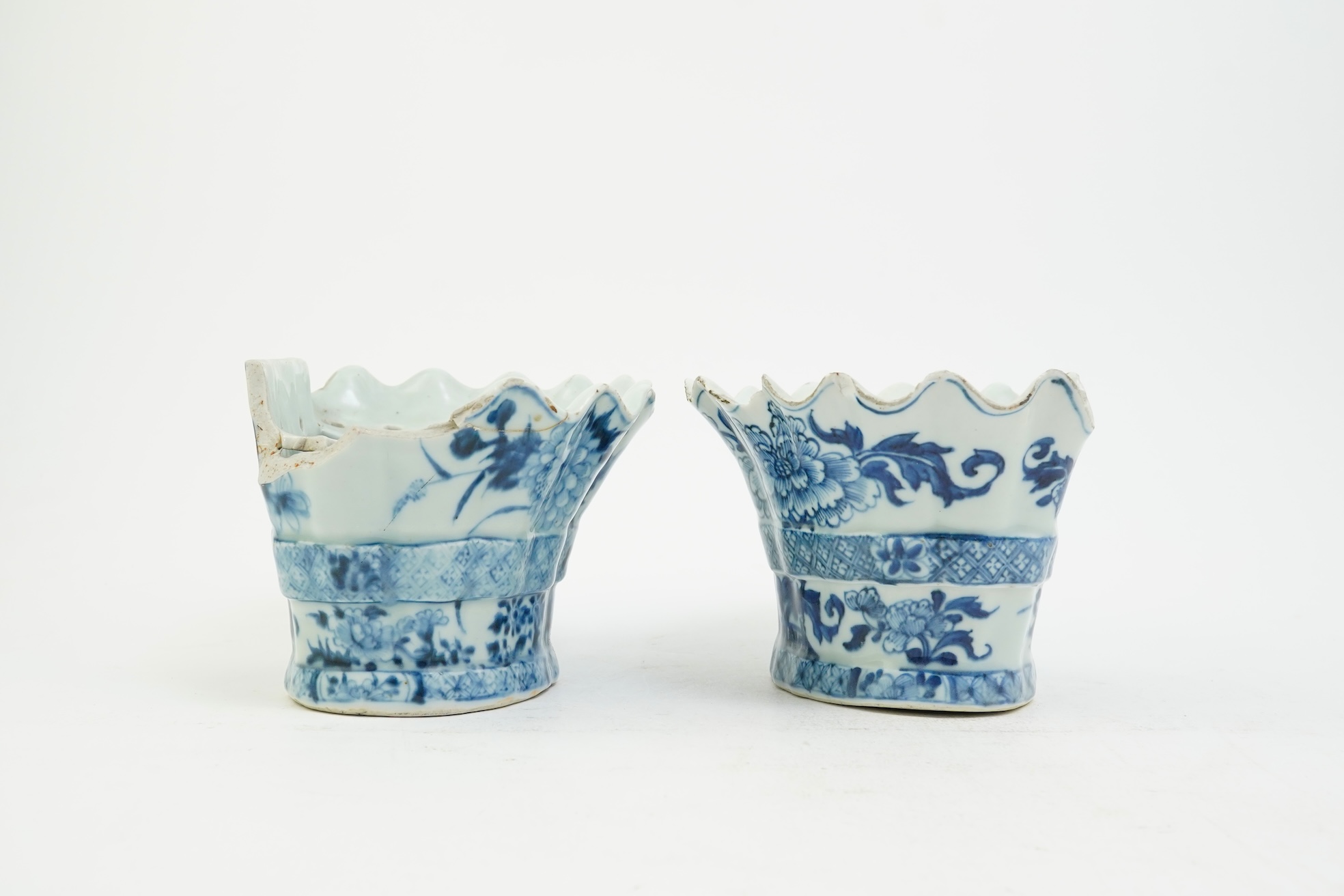 A pair of unusual Chinese export blue and white bough pots, after a Delft model, Qianlong period